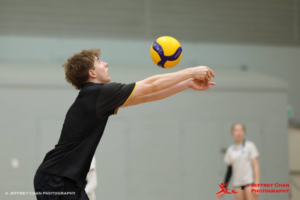 Academy player passing a volleyball during training in Perth
